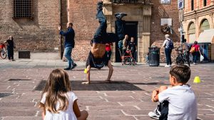 Breakdancer performs for children in city square